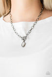 Club Sparkle - Black - Paparazzi Accessories -  Featuring a regal marquise style cut, a glittery white rhinestone swings from the bottom of a gunmetal chain below the collar for a classic look. Features a toggle closure.   Sold as one individual necklace.  Includes one pair of matching earrings.   P2RE-BKXX-285XX