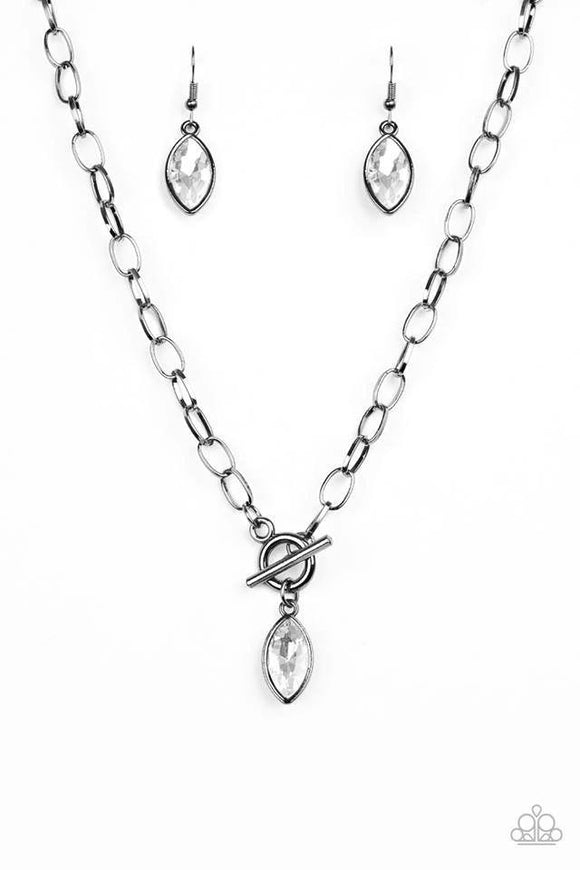 Club Sparkle - Black - Paparazzi Accessories -  Featuring a regal marquise style cut, a glittery white rhinestone swings from the bottom of a gunmetal chain below the collar for a classic look. Features a toggle closure.   Sold as one individual necklace.  Includes one pair of matching earrings.   P2RE-BKXX-285XX