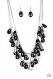 Life of the FIESTA - Black - Paparazzi Accessories -   Two strands of silver chain are decorated in a flirtatious fringe of faceted black teardrops. Glittery beveled silver teardrops are sprinkled between the black beading, adding hints of shimmer to the vibrant design. Features an adjustable clasp closure.  Sold as one individual necklace. Includes one pair of matching earrings.