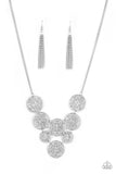 Malibu Idol - Silver - Paparazzi Accessories -  Filled with shiny mandala-like filigree, a cascade of glistening silver discs link below the collar for a whimsical statement-making fashion. Features an adjustable clasp closure.  Sold as one individual necklace. Includes one pair of matching earrings.  #P2WH-SVXX-312PB