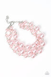 Until The End Of TIMELESS - Pink - Paparazzi Accessories -  Varying in size, classic pink pearls link around the wrist creating three strands for a timelessly layered look. Features an adjustable clasp closure.  Sold as one individual bracelet.