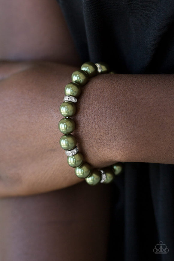 Exquisitely Elite - Green - Paparazzi Accessories -  Classic green pearls and glittery white rhinestone encrusted rings are threaded along a stretchy band, creating a timeless centerpiece around the wrist.  Sold as one individual bracelet.