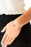 Going For Glitter - Pink - Paparazzi Accessories -  Item #P9DA-PKXX-066XX Varying in shape, glittery pink and white rhinestones join at both ends of a dainty silver cuff, creating refined fittings.  Sold as one individual bracelet.