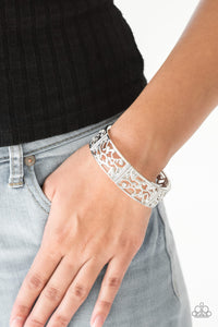 Yours and VINE - White - Paparazzi Accessories -  Item #P9WH-WTXX-164XX Filled with vine-like filigree, shimmery silver frames are threaded along stretchy bands around the wrist for a whimsical look. Dainty white rhinestones are sprinkled along the ornate frames for a sparkling finish.  Sold as one individual bracelet.