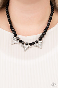 Society Socialite - Black - Paparazzi Accessories -  Item #P2RE-BKXX-266XX A strand of shiny black beads drapes elegantly below the collar. Featuring regal marquise style cuts, glittery white rhinestone frames swing from the beaded strand for a timeless finish. Features an adjustable clasp closure.  Sold as one individual necklace. Includes one pair of matching earrings.