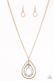 Going For Grit - Gold - Paparazzi Accessories -  Item #P2BA-GDMT-021XX Brushed in a high-sheen shimmer, delicately hammered rose gold and silver teardrop silhouettes swing from the bottom of a lengthened rose gold chain for a rustic look. Features an adjustable clasp closure.  Sold as one individual necklace. Includes one pair of matching earrings.