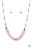 One-WOMAN Show - Pink - Paparazzi Accessories -  Item #P2RE-PKXX-169XX Oversized pink pearls and crystal-like beads give way to layers of beaded pearl strands below the collar for a timeless look. Features an adjustable clasp closure.  Sold as one individual necklace. Includes one pair of matching earrings.