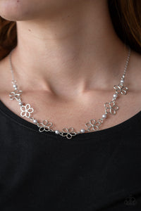 Always Abloom - Silver - Paparazzi Accessories -   Item #P2WH-SVXX-256XX Dainty silver pearls and airy floral frames link below the collar for a seasonal look. Features an adjustable clasp closure.  Sold as one individual necklace. Includes one pair of matching earrings.