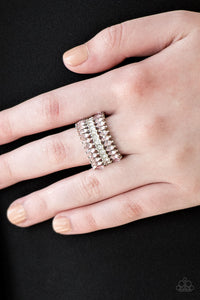 Treasury Fund - Pink - Paparazzi Accessories -  Item #P4RE-PKXX-141XX Featuring refined marquise cuts, glittery pink rhinestones flare from a center of glassy white rhinestones, creating a regal band across the finger. Features a stretchy band for a flexible fit.  Sold as one individual ring.