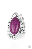 Sedona Sunset - Purple - Paparazzi Accessories -  Item #P4SE-PRXX-046XX Chiseled into a smooth oval, a rich purple stone is pressed into the center of a glistening silver frame radiating with filigree detail for a seasonal look. Features a stretchy band for a flexible fit.  Sold as one individual ring.