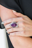 Sedona Sunset - Purple - Paparazzi Accessories -  Item #P4SE-PRXX-046XX Chiseled into a smooth oval, a rich purple stone is pressed into the center of a glistening silver frame radiating with filigree detail for a seasonal look. Features a stretchy band for a flexible fit.  Sold as one individual ring.