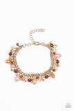 Catwalk Crawl - Gold - Paparazzi Accessories -  Item #P9WH-GDXX-088CB Featuring crystal-like and metallic opaque finishes, mismatched beading swings from a shimmery gold chain, creating a glamorous fringe around the wrist. Features an adjustable clasp closure.  Sold as one individual bracelet.