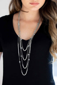 Open for Opulence - Silver - Paparazzi Accessories -  Hematite crystal-like beads trickle along three mismatched silver chains, creating shimmery layers across the chest. Features an adjustable clasp closure.  Sold as one individual necklace. Includes one pair of matching earrings.  P2RE-SVXX-322XX
