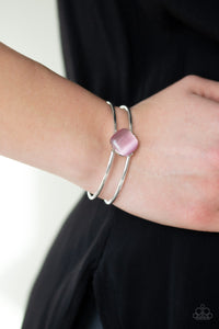 Turn Up The Glow - Pink - Paparazzi Accessories -  Item #P9RE-PKXX-171KH Chiseled into a tranquil square, a glowing pink moonstone is pressed into the center of an airy silver cuff for a perfect pop of color.  Sold as one individual bracelet.