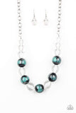 Torrid Tide - Blue - Paparazzi Accessories -  A collection of shiny black and glassy clear beads are threaded along an invisible wire below the collar. The black beads are splashed in hints of refreshing blue and shiny metallic paint for a colorful finish. Features an adjustable clasp closure.  Sold as one individual necklace. Includes one pair of matching earrings.
