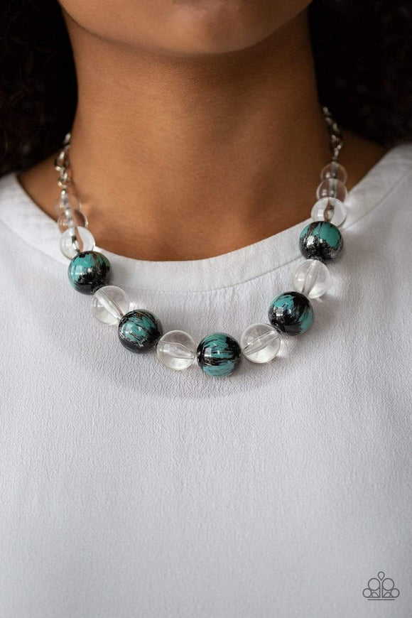 Torrid Tide - Blue - Paparazzi Accessories -  A collection of shiny black and glassy clear beads are threaded along an invisible wire below the collar. The black beads are splashed in hints of refreshing blue and shiny metallic paint for a colorful finish. Features an adjustable clasp closure.  Sold as one individual necklace. Includes one pair of matching earrings.