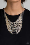 Catwalk Queen - Multi - Paparazzi Accessories - Item #P2RE-MTXX-122XX Strand after strand of metallic gold and silver seed beads fall together to create a bold statement piece. Features an adjustable clasp closure.  Sold as one individual necklace. Includes one pair of matching earrings.