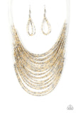 Catwalk Queen - Multi - Paparazzi Accessories - Item #P2RE-MTXX-122XX Strand after strand of metallic gold and silver seed beads fall together to create a bold statement piece. Features an adjustable clasp closure.  Sold as one individual necklace. Includes one pair of matching earrings.