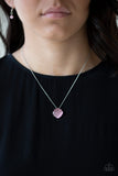 You GLOW Girl - Pink - Paparazzi Accessories -   Item #P2RE-PKXX-216KH Chiseled into a tranquil square, a glowing pink moonstone pendant swings below the collar for a colorfully refined look. Features an adjustable clasp closure.  Sold as one individual necklace. Includes one pair of matching earrings.