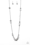 Trailblazing Trinket - Silver - Paparazzi Accessories -   Item #P2WH-SVXX-326XX Floral stamped and scratched silver discs trickle along a lengthened silver chain. Hammered and scratched silver discs dangle from the bottom, creating a noisy fringe. Features an adjustable clasp closure.  Sold as one individual necklace. Includes one pair of matching earrings.