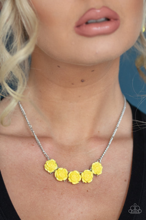 Garden Party Posh - Yellow - Paparazzi Accessories -  Item #P2WH-YWXX-243XX Attached to a shimmery silver chain, a dainty collection of yellow resin roses collect beneath the collar for a whimsical look. Features an adjustable clasp closure.  Sold as one individual necklace. Includes one pair of matching earrings.