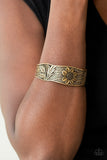 Daisy Paradise - Brass - Paparazzi Accessories -  Item #P9WH-BRXX-104XX The front of an asymmetrical brass cuff is stamped and embossed in lacy vines and a leafy floral pattern for a whimsical fashion.  Sold as one individual bracelet.