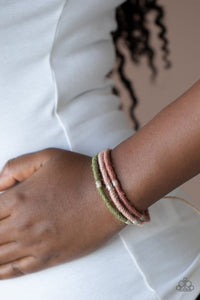 Beach Boundaries - Multi - Paparazzi Accessories -  Item #P9UR-MTXX-199XX Featuring rustic pink, Rose Tan, and Military Olive hues, silver beaded hemp-like cording wraps into three colorful strands around the wrist for a seasonal flair. Features an adjustable sliding knot closure.  Sold as one individual bracelet.   This piece was featured as part of our Fall Training during Unwritten.