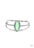 Stone Sahara - Green - Paparazzi Accessories -   Item #P9WH-GRXX-157XX A glittery green stone is pressed into a decorative silver frame atop a mismatched layered cuff, creating a seasonal sparkle around the wrist.  Sold as one individual bracelet.