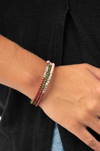 Spiral Dive - Multi - Paparazzi Accessories -  Item #P9WH-MTXX-113XX Infused with sections of shimmery silver cubes, a colorful collision of Rose Tan, Military Olive, and Fired Brick beads are threaded along a coiled wire, creating an earthy infinity wrap style bracelet around the wrist.  Sold as one individual bracelet.