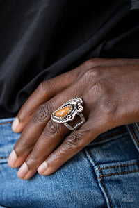 Palm Princess - Orange  Item #P4SE-OGXX-103XX A palm-like silver feather curls around an asymmetrical orange stone that is nestled inside a decorative silver frame for a seasonal flair. Features a stretchy band for a flexible fit.  Sold as one individual ring.