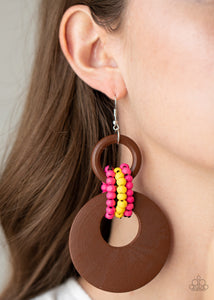 Beach Day Drama - Multi - Paparazzi Accessories -  Item #P5SE-MTXX-114XX Pink and yellow wooden beaded links connect together a brown wooden ring and an oversized brown wooden crescent-like hoop, creating a vivaciously earthy lure. Earring attaches to a standard fishhook fitting.  Sold as one pair of earrings.