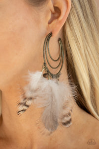 Freely Free Bird - Brass - Paparazzi Accessories -  Item #P5HO-BRXX-075XX Whimsical feathers and wooden cube beads swing from the outer edge of a layered brass hoop that ripples out into an airy crescent. Earring attaches to a standard post fitting. Hoop measures approximately 2 1/4" in diameter.  Sold as one pair of hoop earrings.