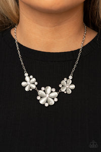 Effortlessly Efflorescent - White - Paparazzi Accessories -  Item #P2WH-WTXX-271XX Dotted with glassy white rhinestone centers, a trio of white cat's eye stone petaled flowers blossom below the collar for an enchanted look. Features an adjustable clasp closure.  Sold as one individual necklace. Includes one pair of matching earrings.