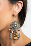 Desert Plains - White - Paparazzi Accessories -  Item #P5ST-WTXX-019XX Radiating with studded patterns, a white stone dotted silver frame gives way to a whimsical collection of silver feather charms, wooden cube beads, refreshing white stones, and a brown feather, creating a whimsical fringe. Earring attaches to a standard fishhook fitting.  Sold as one pair of earrings.