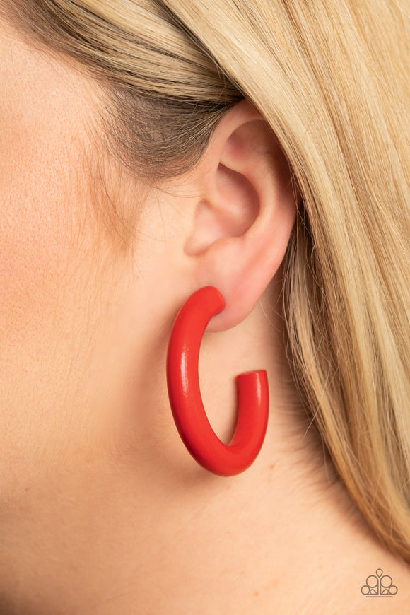 Woodsy Wonder - Red - Paparazzi Accessories -  Item #P5HO-RDXX-021XX Painted in a fiery red finish, a thick wood hoop curls around the ear for a flirtatiously colorful look. Earring attaches to a standard post fitting. Hoop measures approximately 2