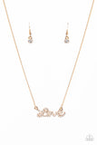 Head Over Heels In Love - Gold - Paparazzi Accessories -  Item #P2RE-GDXX-356XX Encrusted in glassy white rhinestones, the word, "love," connects to a dainty gold chain, creating a flirty pendant below the collar. Features an adjustable clasp closure.  Sold as one individual necklace. Includes one pair of matching earrings.