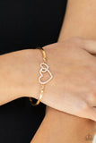 Cupid is Calling - Gold - Paparazzi Accessories -  Encrusted in dainty white rhinestones, a charming pair of interlocking heart frames attach to two gold bars around the wrist, creating a flirty bangle-like bracelet. Features an adjustable clasp closure.  Sold as one individual bracelet.