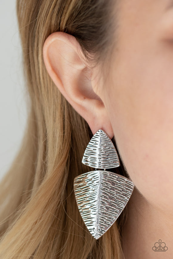 PRIMAL Factors - Silver - Paparazzi Accessories -  Item #P5PO-SVXX-189XX Etched in antiqued linear details, a pair of beveled silver frames delicately link into a handcrafted lure for a bold tribal flair. Earring attaches to a standard post earring.  Sold as one pair of post earrings.