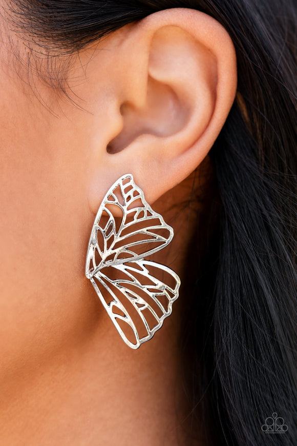 Butterfly Frills - Silver - Paparazzi Accessories -   August '21 Life of the Party!  Item #P5PO-SVXX-186XX Shimmery silver bars delicately climb scalloped silver frames, coalescing into a whimsical butterfly wing. Earring attaches to a standard post fitting.  Sold as one pair of double-sided post earrings.