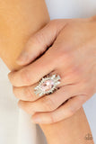 Icy Icon - Pink - Paparazzi Accessories -  Item #P4RE-PKXX-228XX An icy collection of round, marquise, and emerald style white rhinestones radiate out from a pink gem center, creating a glamorous centerpiece atop the finger. Features a stretchy band for a flexible fit.  Sold as one individual ring.