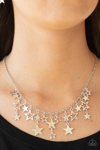 Stellar Stardom - Silver - Paparazzi Accessories -   Item #P2WH-SVXX-335XX A mismatched collection of shiny silver stars cascade from a dainty silver chain, creating a stellar fringe below the collar. Features an adjustable clasp closure.  Sold as one individual necklace. Includes one pair of matching earrings.