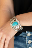 The MESAS are Calling - Blue - Paparazzi Accessories -  Item #P9SE-BLXX-336XX An asymmetrical turquoise stone is pressed into the center of a silver cuff layered with filigree patterns around the wrist for a rustic flair.  Sold as one individual bracelet.