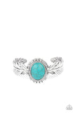 Western Wings - Blue - Paparazzi Accessories - Item #P9SE-BLXX-338XX Stamped and embossed in lifelike textures, two shiny silver feathers branch out from a turquoise stone frame featuring rustic silver details. The whimsical centerpiece curls around the wrist, creating a free-spirited cuff.  Sold as one individual bracelet.