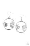 Demurely Daisy - Silver - Paparazzi Accessories -   Item #P5WH-SVXX-226XX A pair of airy daisies bloom inside a hammered silver hoop, creating a whimsically seasonal display. Earring attaches to a standard fishhook fitting.  Sold as one pair of earrings.