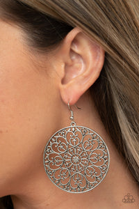 Make A MANDALA Out Of You - Silver - Paparazzi Accessories -  Item #P5WH-SVXX-221XX Decorative silver filigree fills the center of a silver hoop, creating a whimsical mandala pattern. Earring attaches to a standard fishhook fitting.  Sold as one pair of earrings.