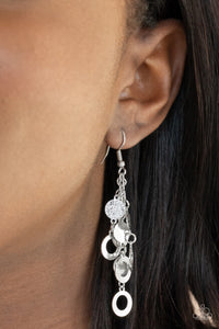 Im Always BRIGHT - Silver - Paparazzi Accessories -  Item #P5RE-SVXX-294XX Hammered in a high sheen shimmer, dainty silver discs and rings cascade from the ear, creating a blinding tassel. Earring attaches to a standard fishhook fitting.  Sold as one pair of earrings.