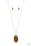 Elemental Elegance - Brown - Paparazzi Accessories -   Item #P2SE-BNXX-191XX Encased in a classic gold fitting, a glassy Tiger's Eye stone swings from the bottom of a lengthened gold chain for an elegantly earthy look. Features an adjustable clasp closure.  Sold as one individual necklace. Includes one pair of matching earrings.