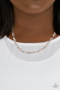 Incredibly Iridescent - Pink - Paparazzi Accessories -  Item #P2RE-PKXX-298XX Attached to a dainty silver chain, trios of pink iridescent crystal-like beads are delicately threaded along silver rods below the collar for a timelessly twinkly look. Features an adjustable clasp closure.  Sold as one individual necklace. Includes one pair of matching earrings.