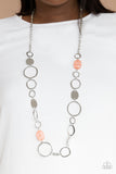 Colorful Combo - Orange - Paparazzi Accessories -   Item #P2WH-OGXX-214XX Infused with glassy coral accents, a shiny series of asymmetrical hoops and discs delicately link across the chest for a flirty pop of color. Features an adjustable clasp closure.  Sold as one individual necklace. Includes one pair of matching earrings.