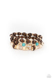 Belongs In The Wild - Gold - Paparazzi Accessories -  Item #P9SE-GDXX-037XX A mismatched collection of brown wooden beads, gold accents, turquoise stones, and glassy beads are threaded along stretchy bands, creating colorful layers around the wrist.  Sold as one set of three bracelets.